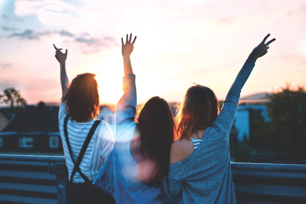 photo-of-three-women-lifting-there-hands-tximrx3gc-g The World is ours